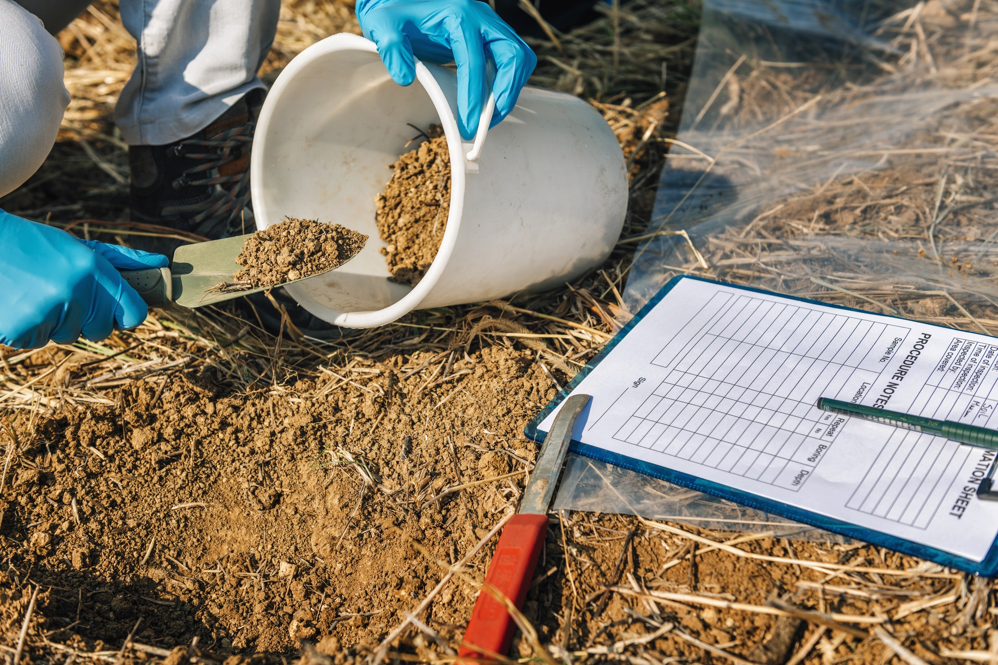 Soil Testing. Agronomy Inspector Taking Soil Sample